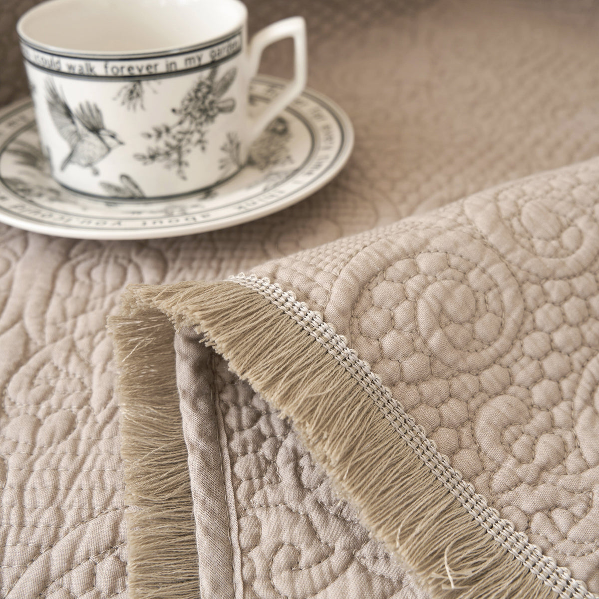 DaDa Bedding Elegant Fringed Cotton Quilted Throw Blanket - Luxurious Solid Soft Paisley Pattern, Cozy Lightweight Lap Throw, Perfect for Couch or Bed, Neutral Sandy Taupe Tan Beige, 50x60 Inches